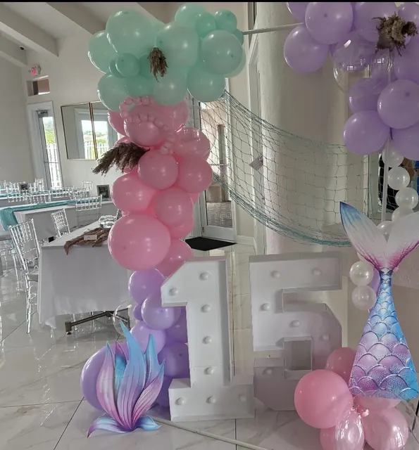 Light-up 15 marquee numbers with a pink, mint and lavender balloon garland
